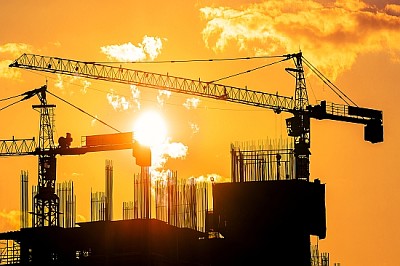 Tower cranes and building silhouettes at  sunrise jigsaw puzzle