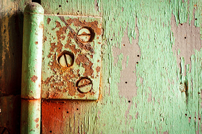 Old rusty hinge with bolts in it. Grungy green pai jigsaw puzzle