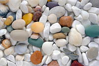 Light sea multi-colored stones close up. Backgroun